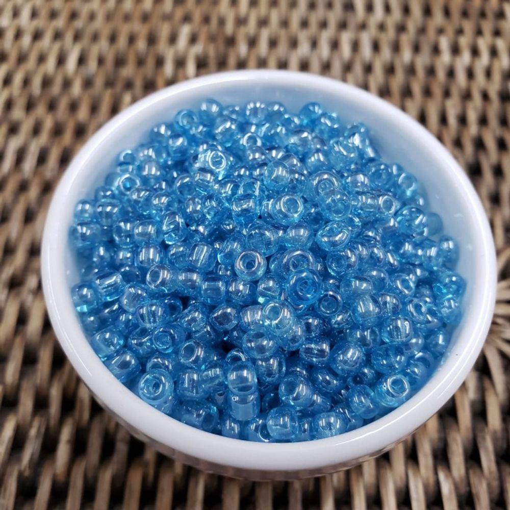 Miçanga Chinesa Transparente Lustrosa Azul - 6/0(4,1mm) 500g