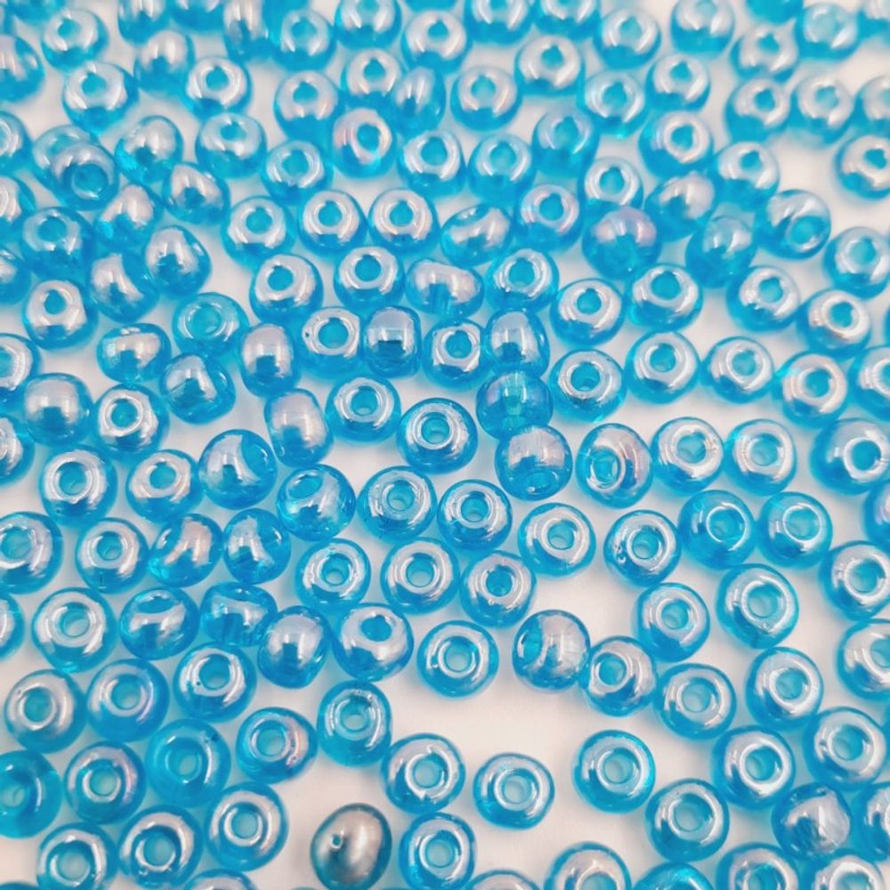 Miçanga Indiana Transparente Azul Claro Lustroso - 6/0(4,1mm) 500 gramas