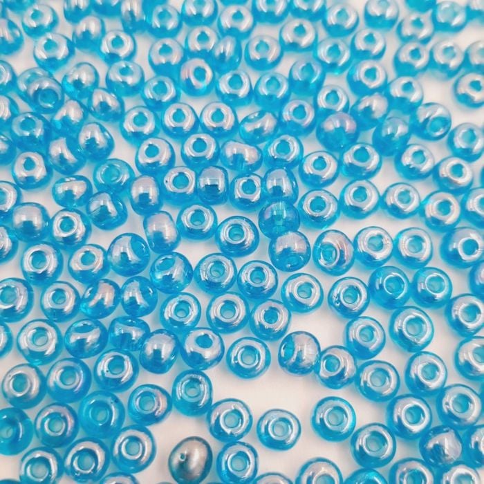 Miçanga Asmara Transparente Azul Claro Lustroso - 6/0(4,1mm) 25g Aprox. 300 Peças