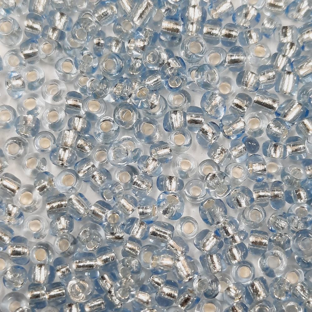 Miçanga Chinesa Transparente Azul Prata - 9/0(2,6mm) 25g