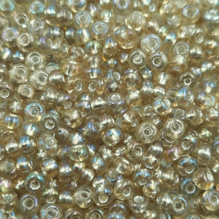 Miçanga Asmara Transparente Aurora Boreal Mel Claro 17029 - 6/0(4,1mm) 25g Aprox. 300 Peças