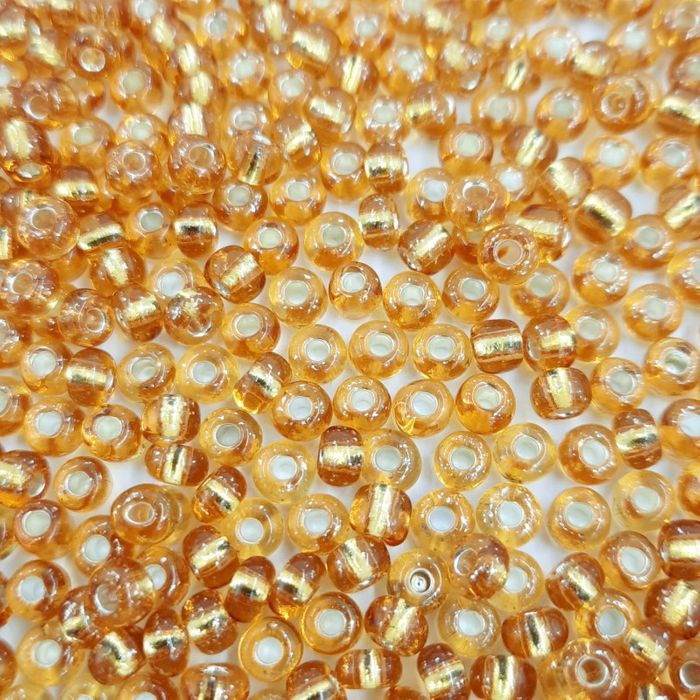 Miçanga Chinesa Transparente Mel 22C - 6/0(4,1mm) 25g Aprox. 260 Peças