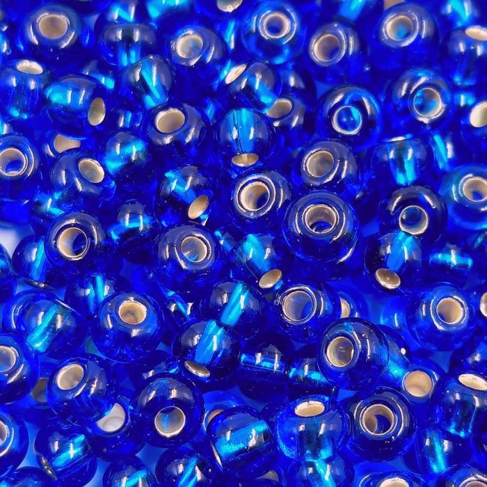 Miçanga Preciosa Ornela Transparente Azul 67300 - 6/0(4,1mm) 25g Aprox. 300 Peças