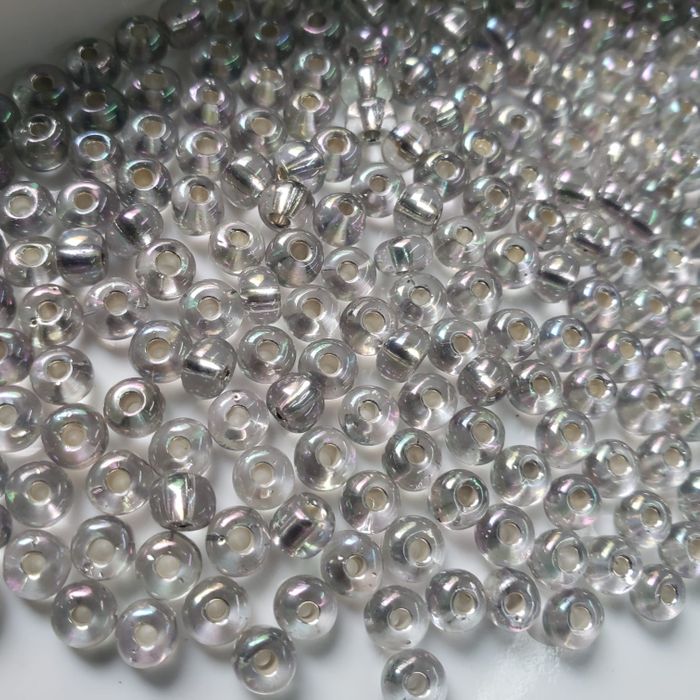 Miçanga Asmara Transparente Prata Aurora Boreal 78105 - 6/0(4,1mm) 25g Aprox. 300 Peças