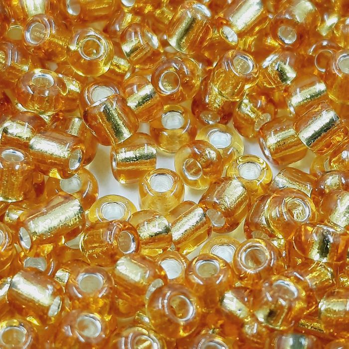 Miçanga Chinesa Transparente Mel 22C - 6/0(4,1mm) 500g