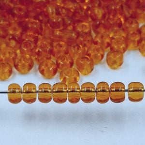25g Miçanga Gold Transparente Topázio 2B - 6/0(4,1mm) Aprox. 260Peças