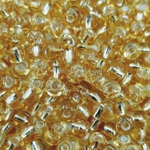 Miçanga Asmara Transparente Mel 17050 - 6/0(4,1mm) 25g Aprox. 300 Peças